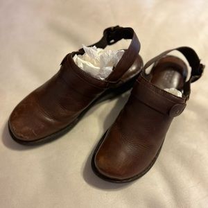 BORN brown size 9 slip in clogs with strap. Very comfortable.